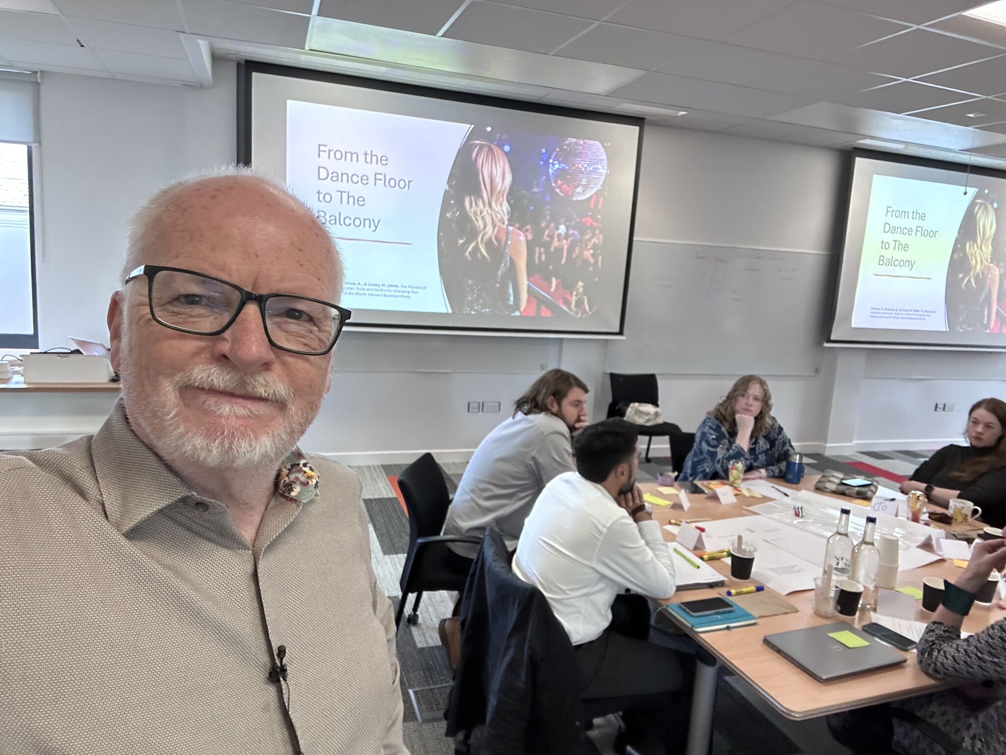 MPFG facilitator leading collaborative innovation workshop with participants brainstorming and problem-solving